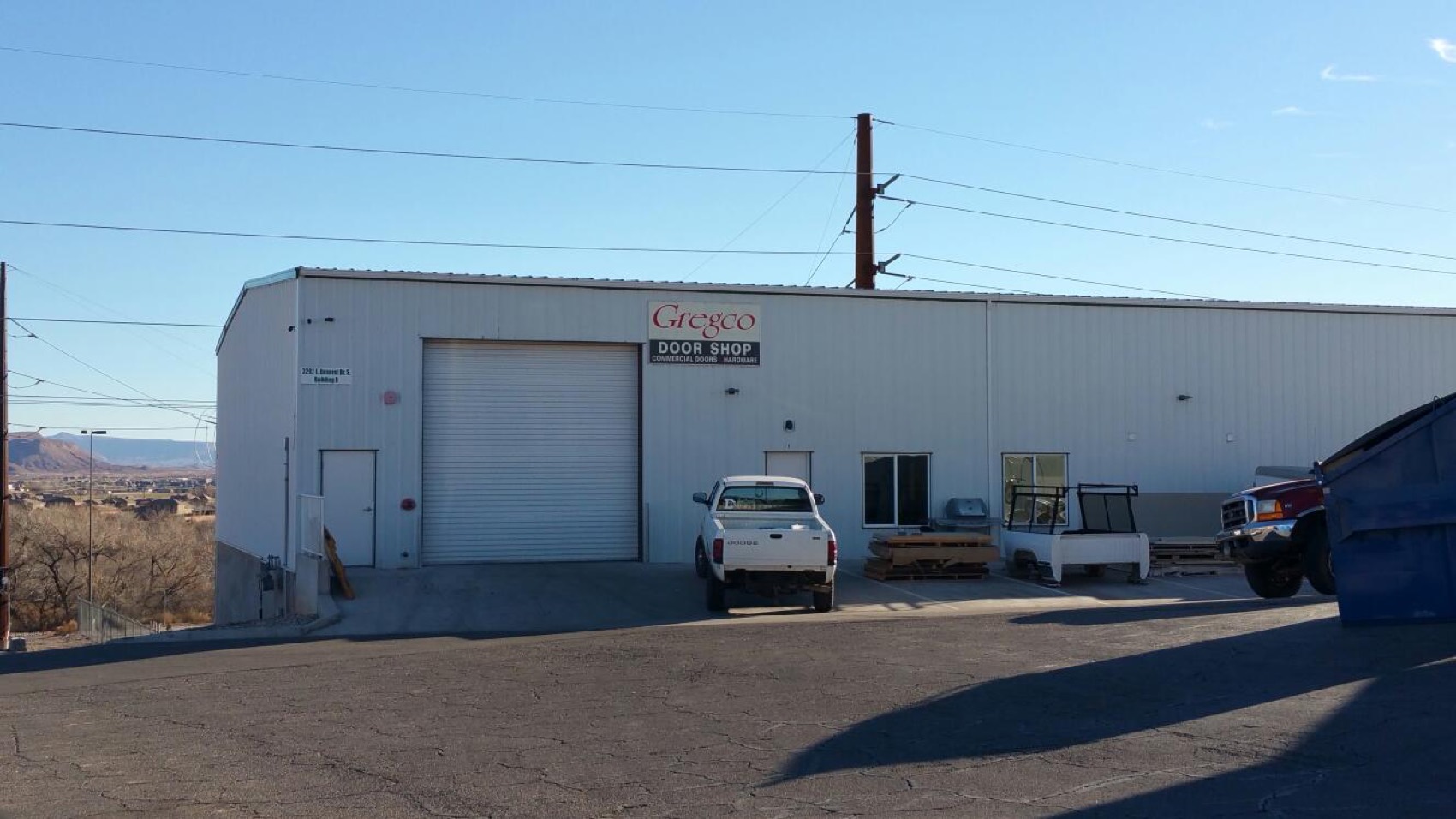Gregco's steel warehouse and work truck against the Southern Utah desert